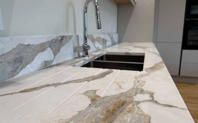 Sahara Waves quartz worktops and sink run in Winchcombe
